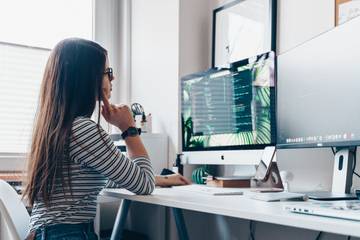 Girl thinking near computer