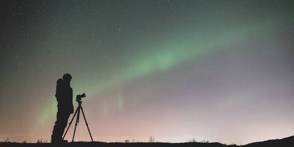 Person taking photos at night 