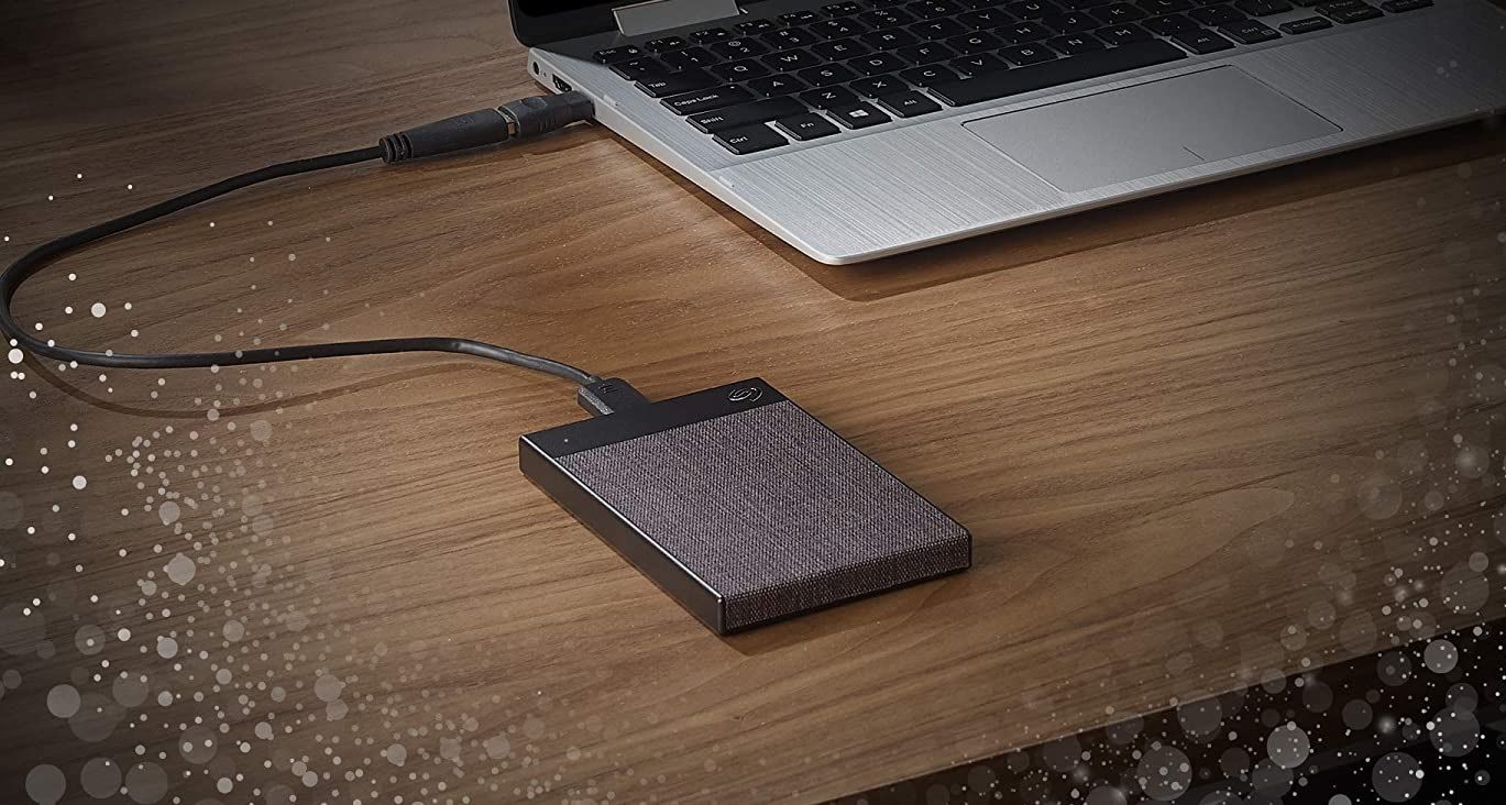 the seagate ultra touch external hard drive plugged into a laptop