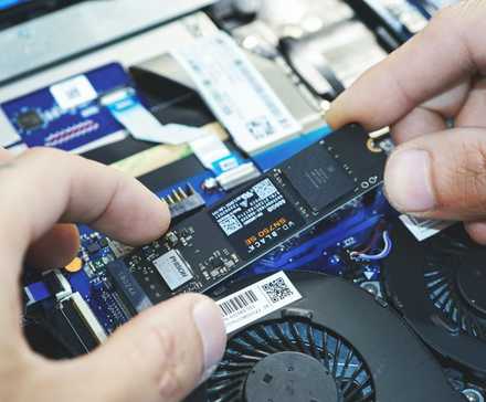 a man holding SSD in hand
