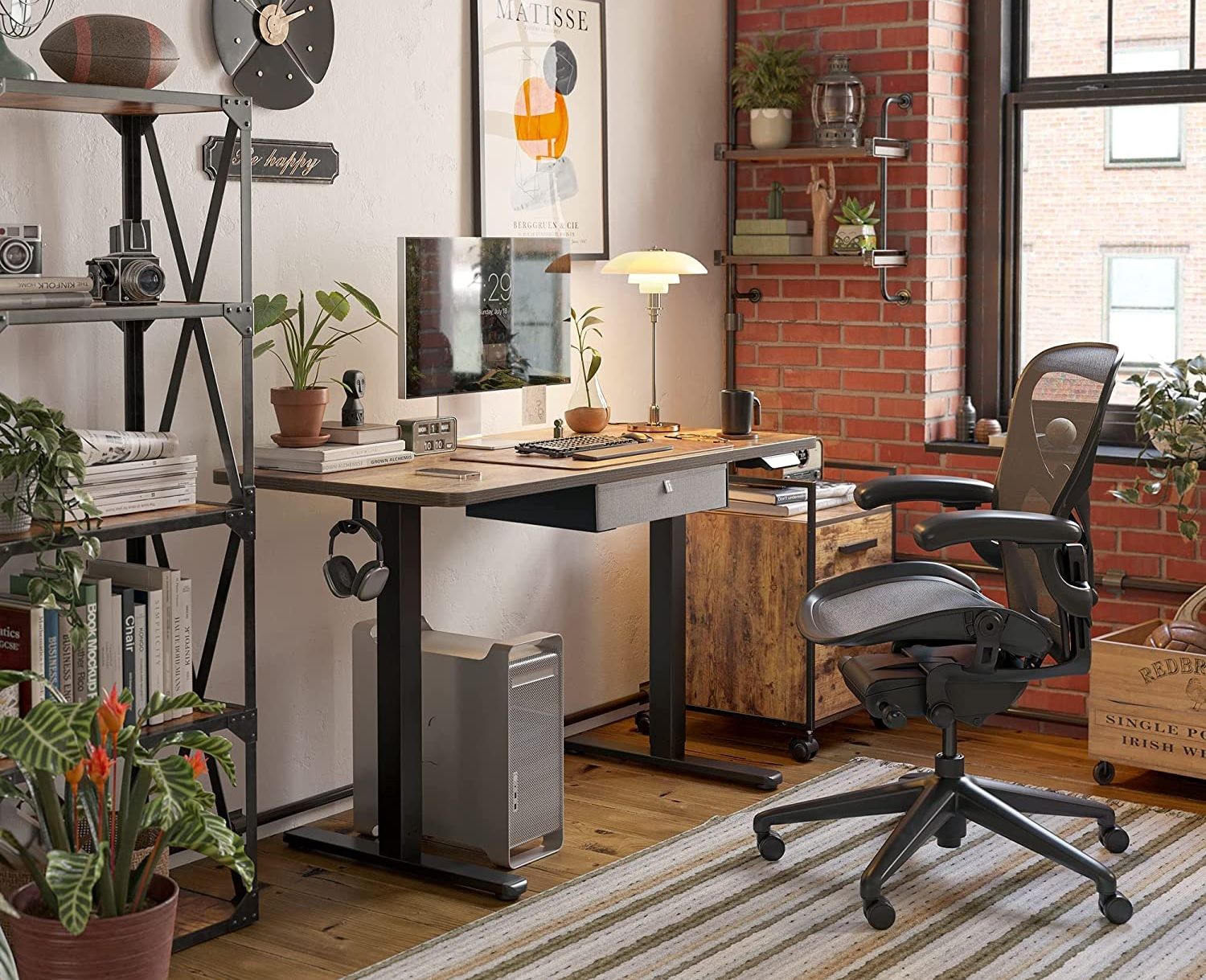 the fezibo standing desk positioned in an office with rustic decorations