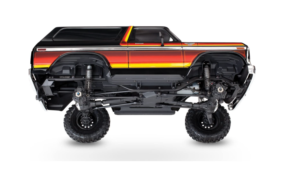 A tilted Traxxas TRX-4 Ford Bronco showing the underside
