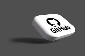 The GitHub logo on a three-dimensional white tile.