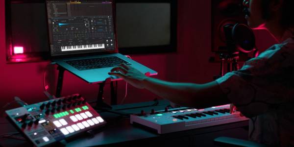 Music producer in studio using VST Synth Pigments