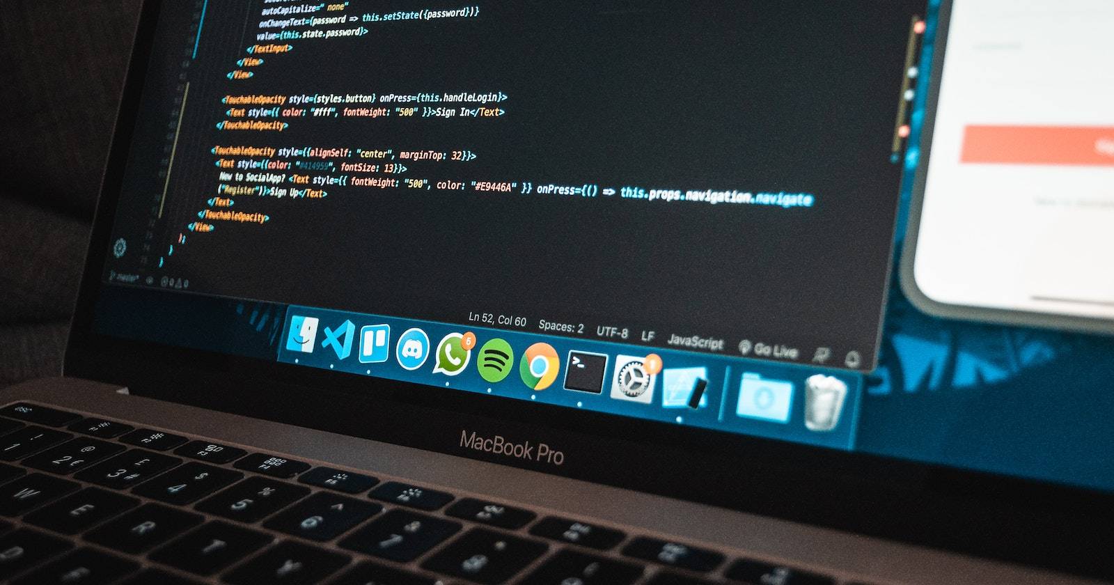 MacBook Pro laptop with program code on screen
