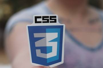 Person holding css3 logo