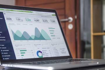 A laptop with data visualization displayed on it