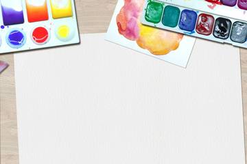 Paintbrush, colors, and drawing paper