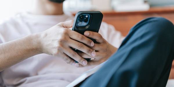 Man holding black smartphone