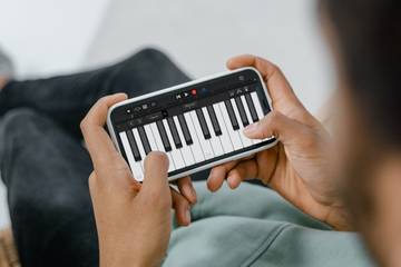 person using GarageBand on an iPhone