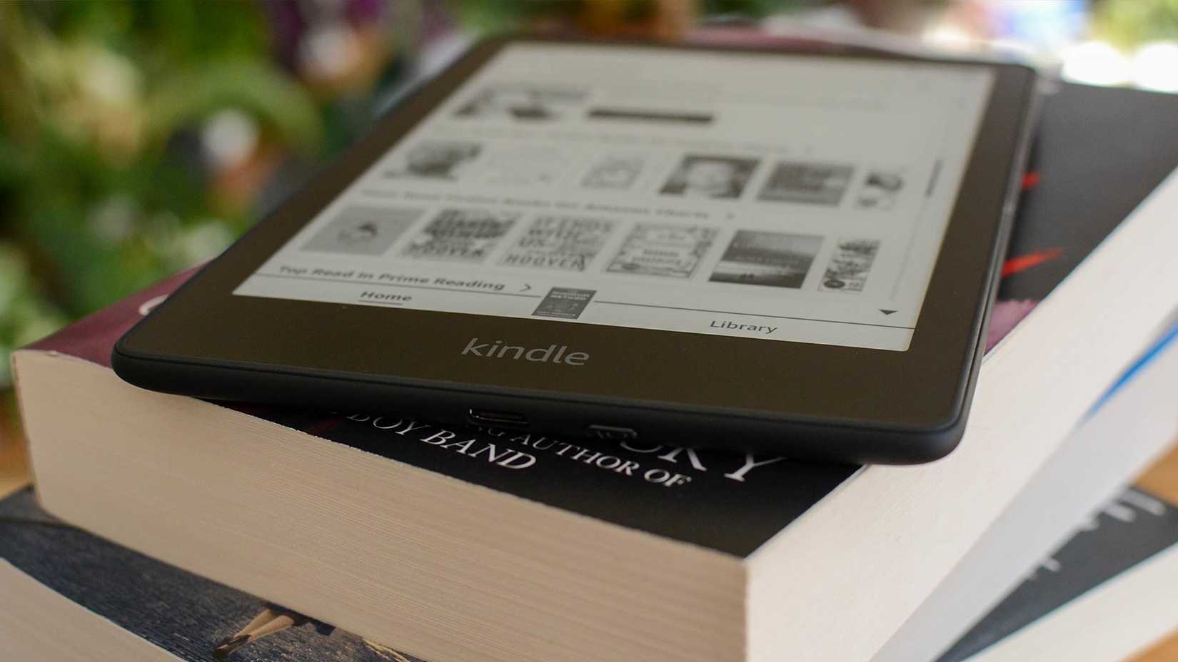 Kindle Paperwhite Signature Edition on a stack of books