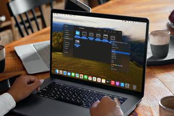 person renaming files on a MacBook