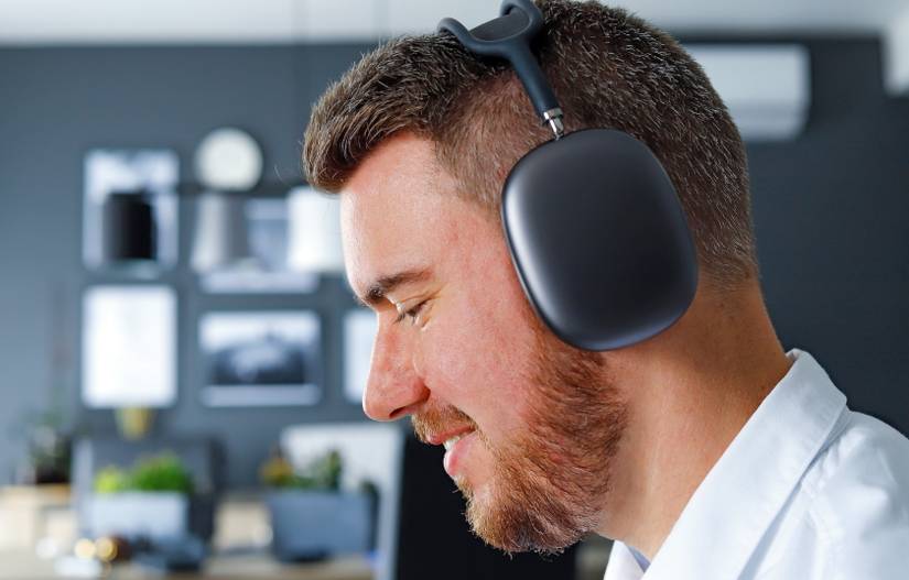 person wearing AirPods Max - 8 Ways Apple Could Improve the AirPods Max