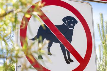 a dog is pictured on a not allowed sign