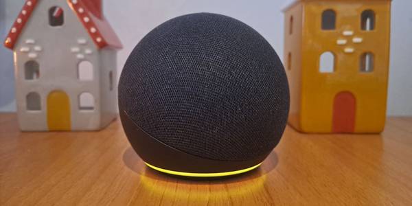 image of amazon echo speaker with flashing yellow light on desk