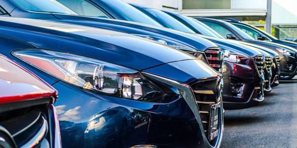 close up shot of row of mercedes cars in lot 