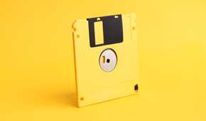 yellow floppy disk on yellow background