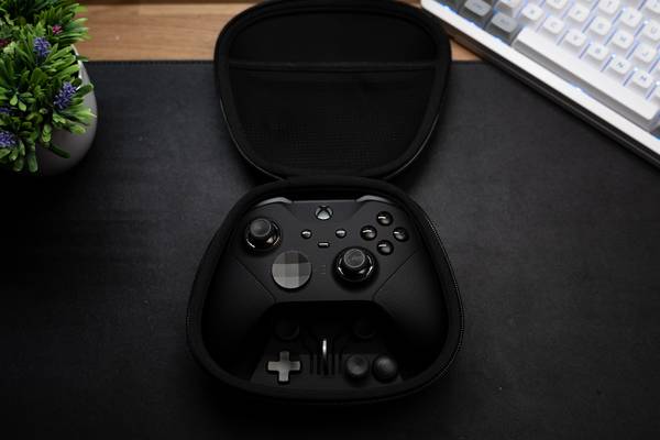 A Microsoft Elite Controller sitting on a desk.