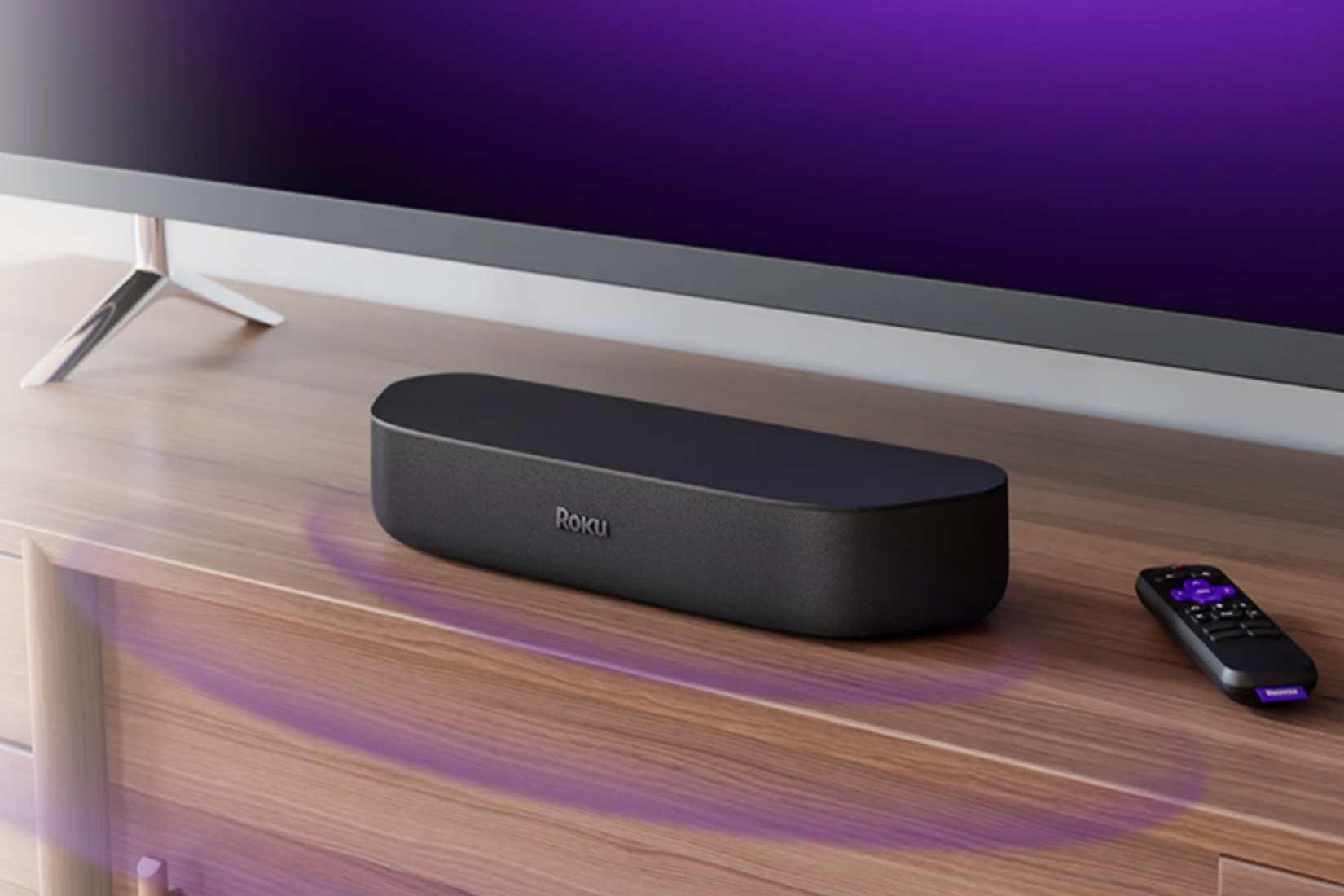 A Roku Streambar under a TV