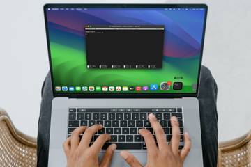 A person using Terminal on their MacBook Pro