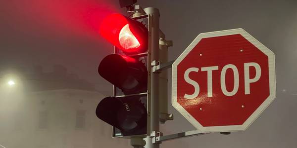 A set of traffic lights showing a red light next to a 