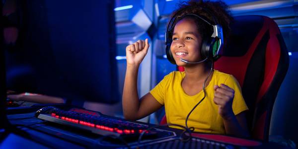 young girl playing a pc game