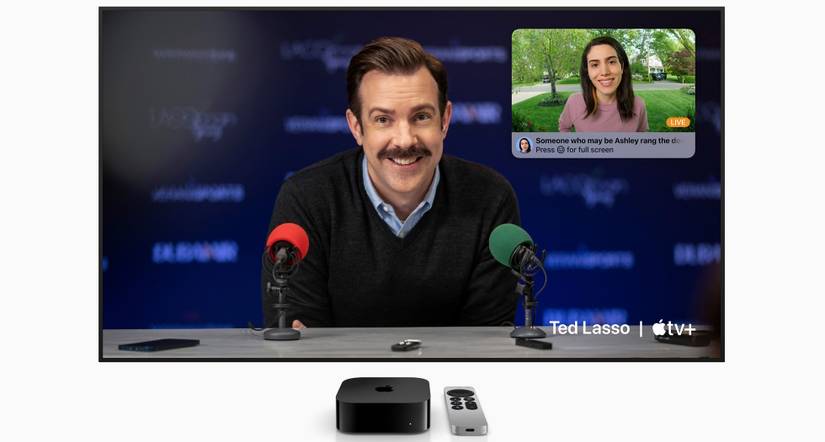 Apple TV 4K in front of a big screen showing HomeKit Secure Video face recognition