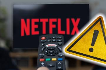 netflix logo on tv screen with yellow error warning symbol