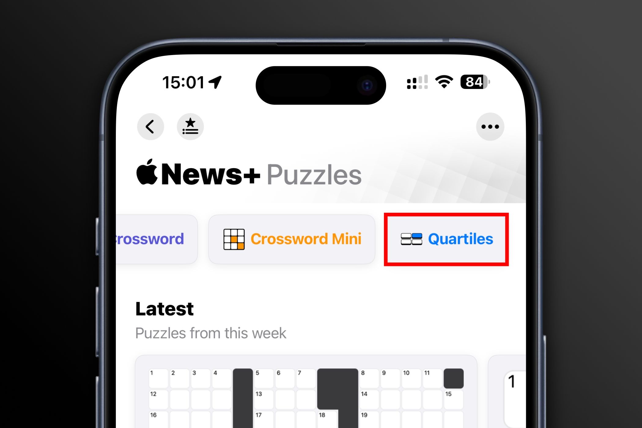 Puzzles section in the iPhone's News app with the Quartiles word game highlighted.