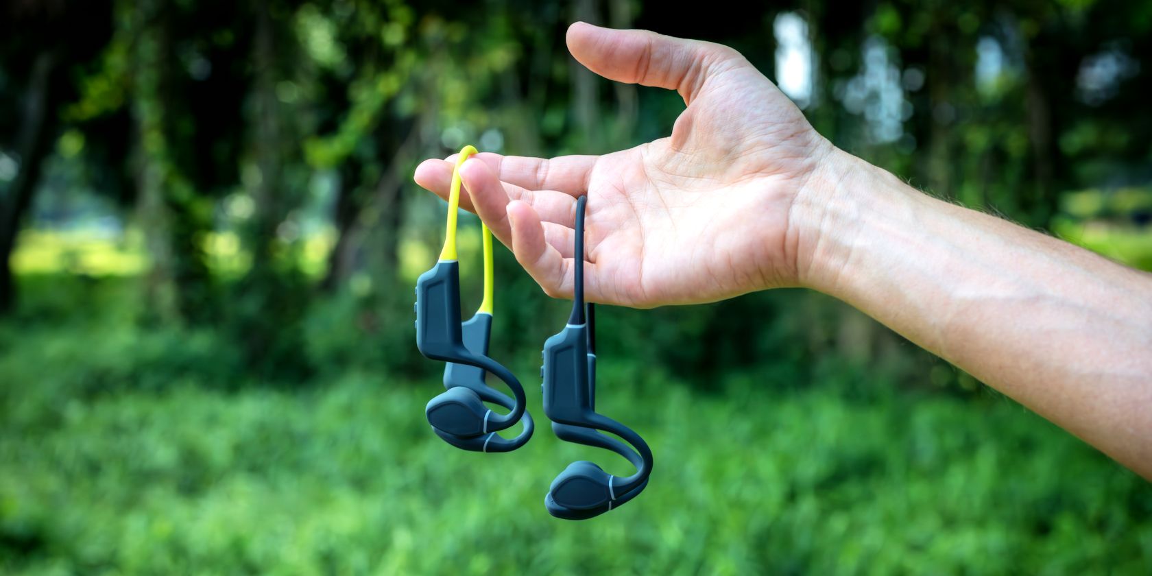man holding bone conduction headphones-1