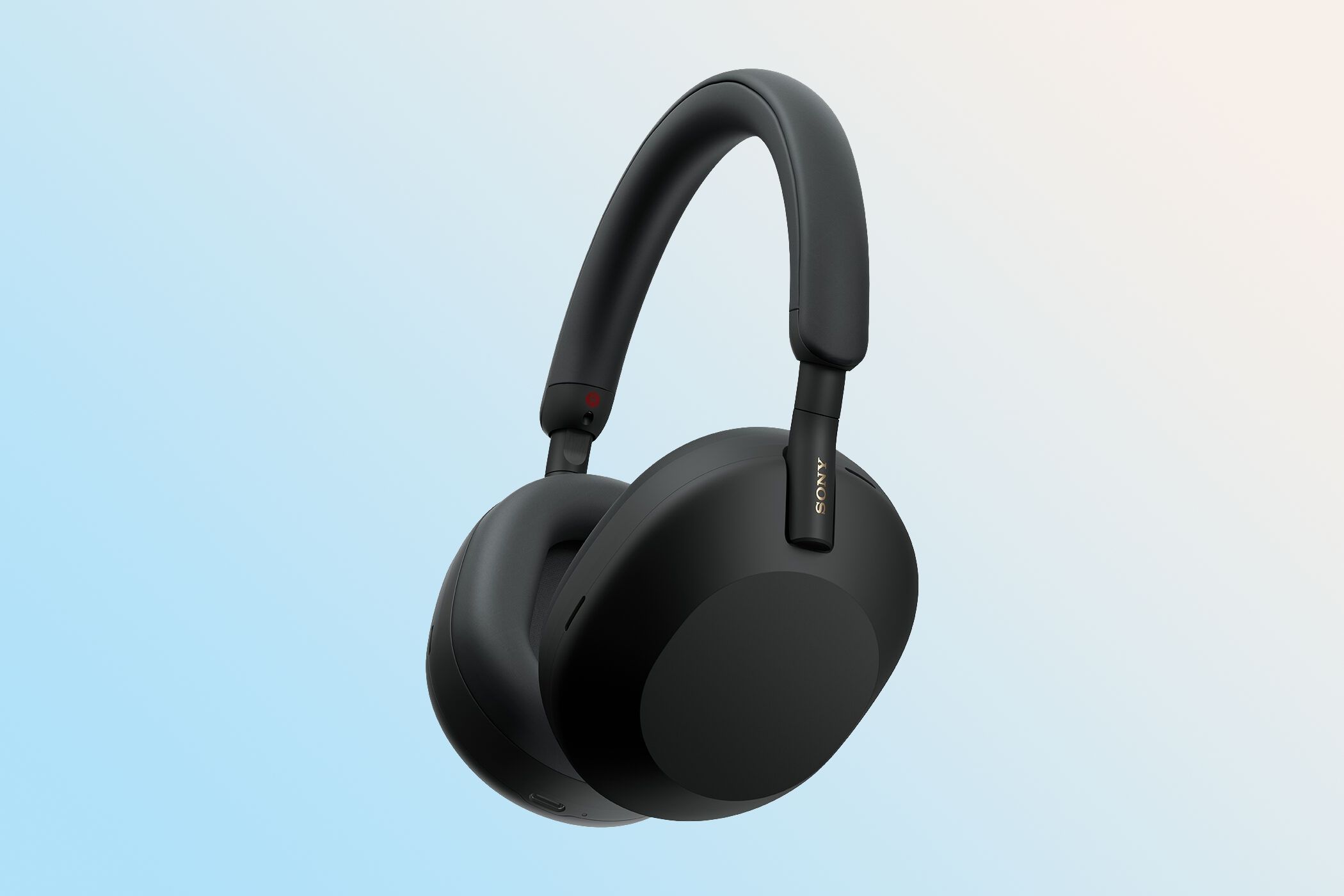 Sony's over-ear headphones set against a colorful gradient background.