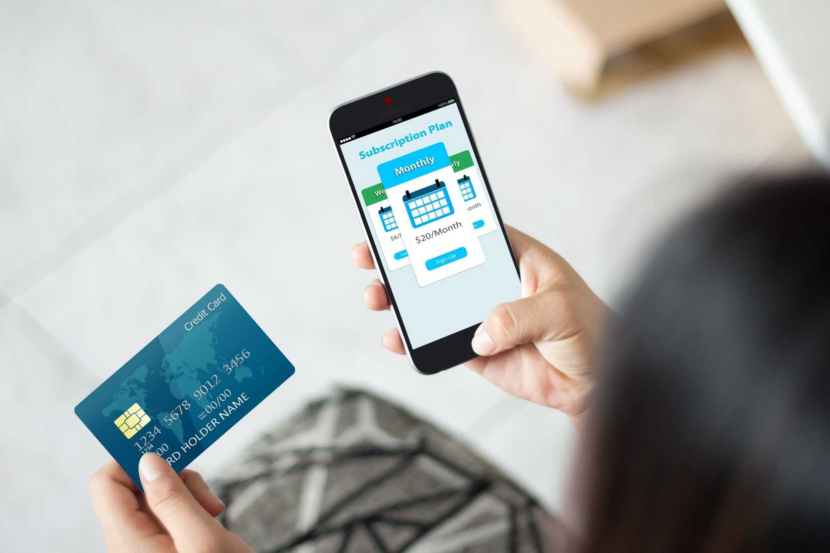 Get Ready to buy atm skimmer Person Using Credit Card to Buy Subscription on Phone