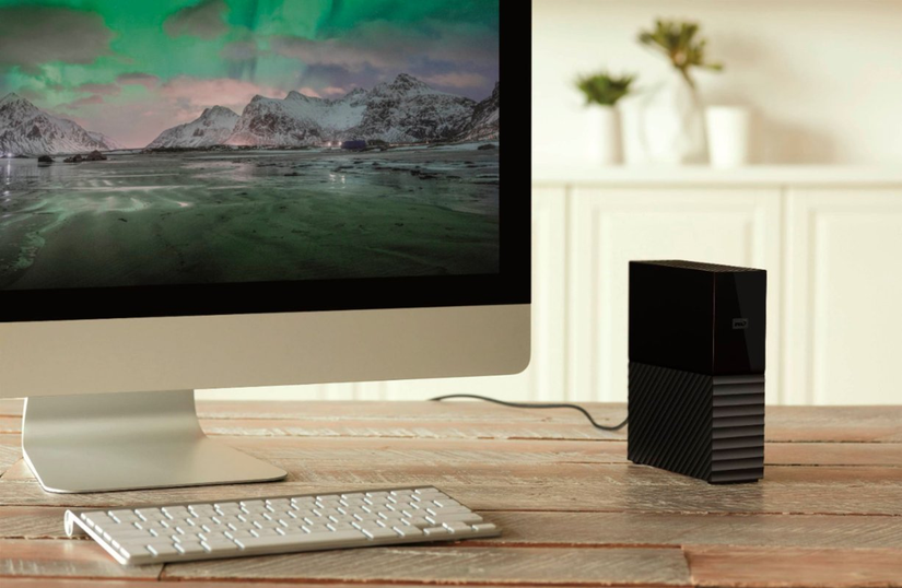 western digital my book external hdd next to apple imac