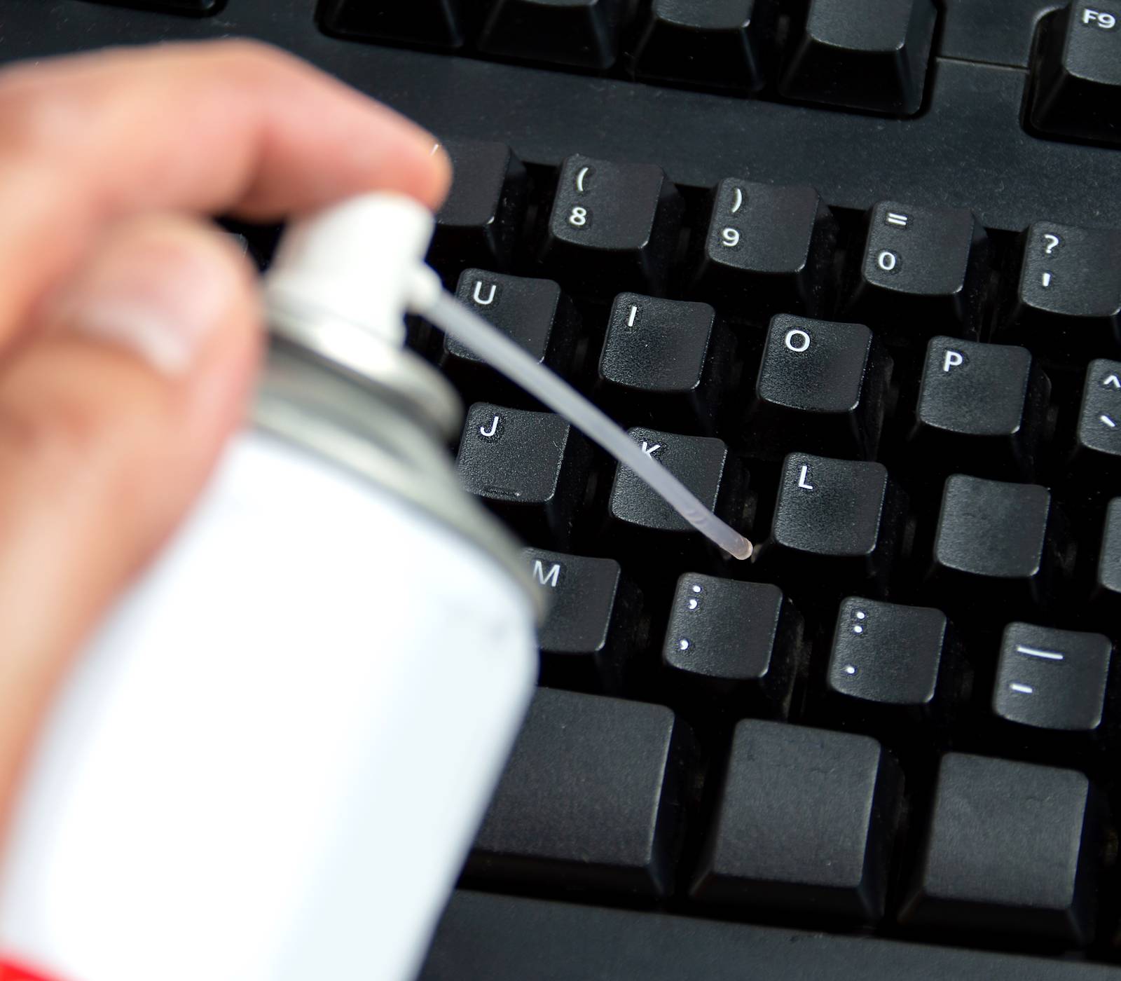 Keyboard cleaning compressed air under keys