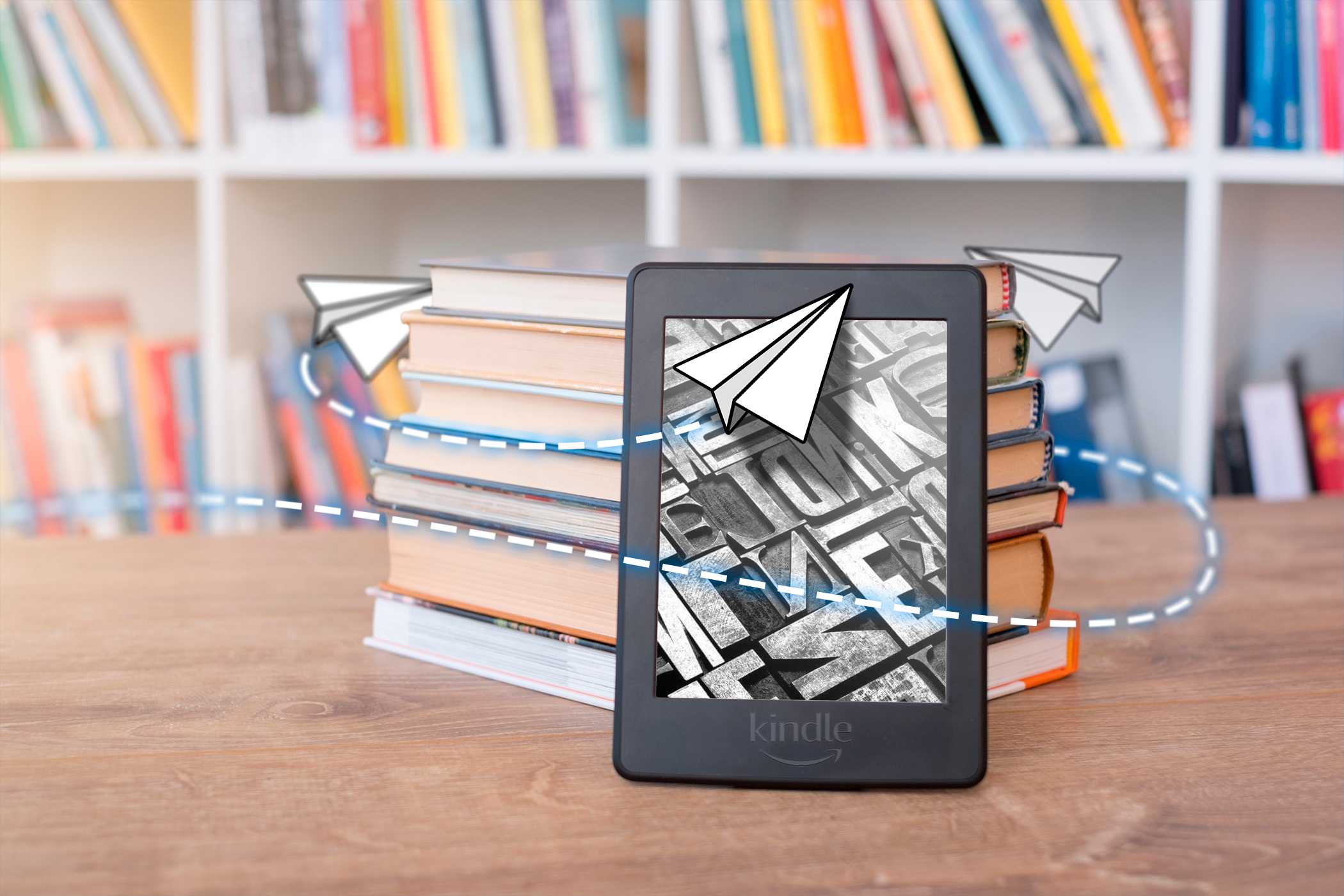 A Kindle leaning against a stack of books with an illustration related to sending around it.