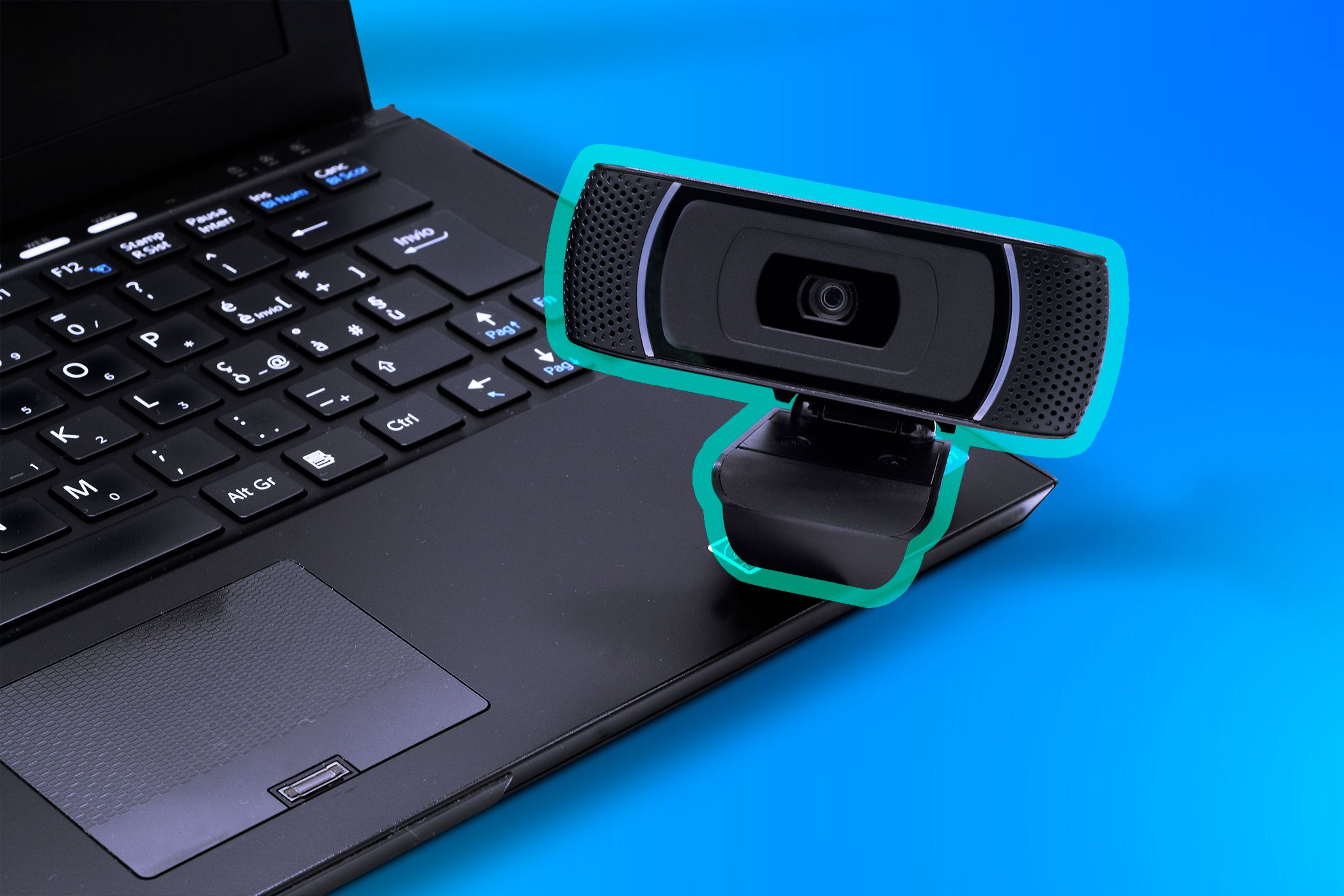 A laptop with an external webcam.