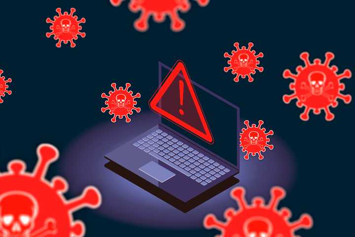 A laptop with an alert icon surrounded by viruses.