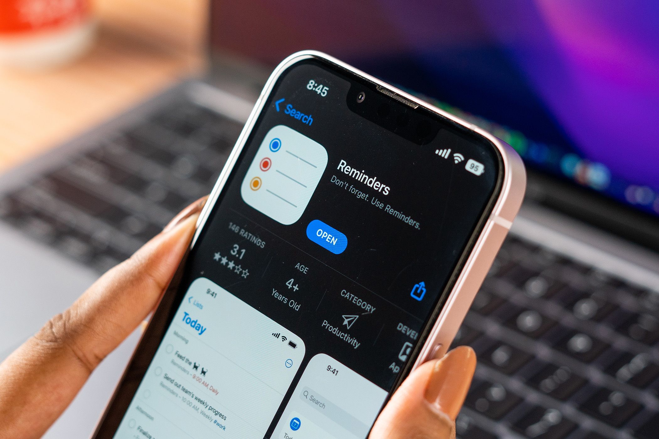 Apple Reminders logo on phone screen stock image