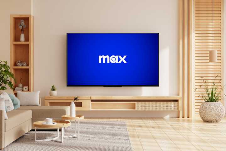 hbo max logo on tv in well lit living room