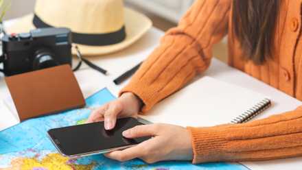 person planning flight on smartphone.