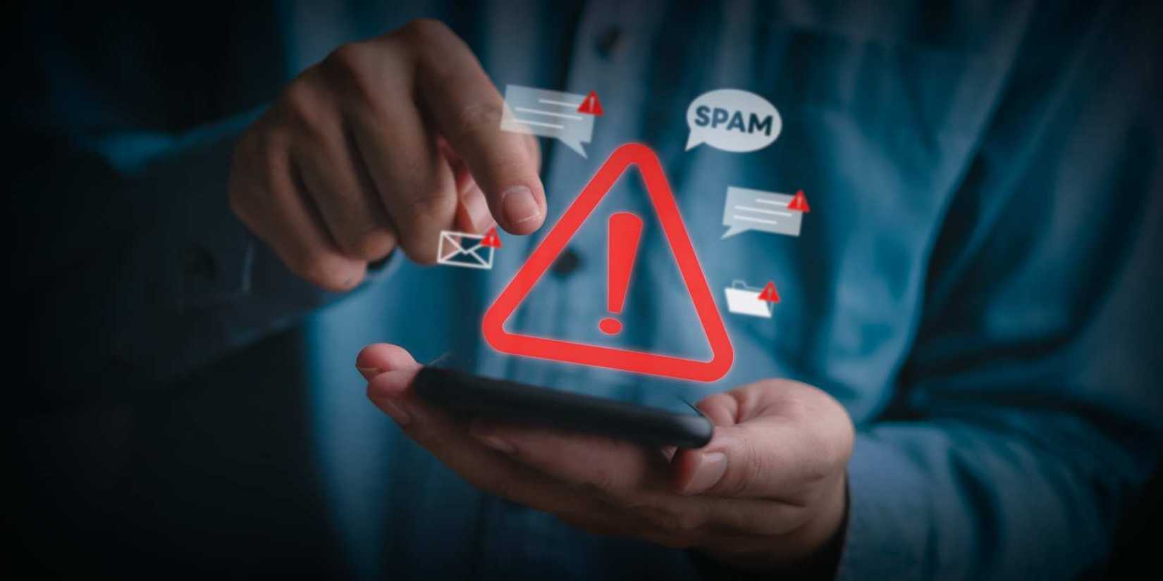 A person using a phone with different spam and warning icons popping out