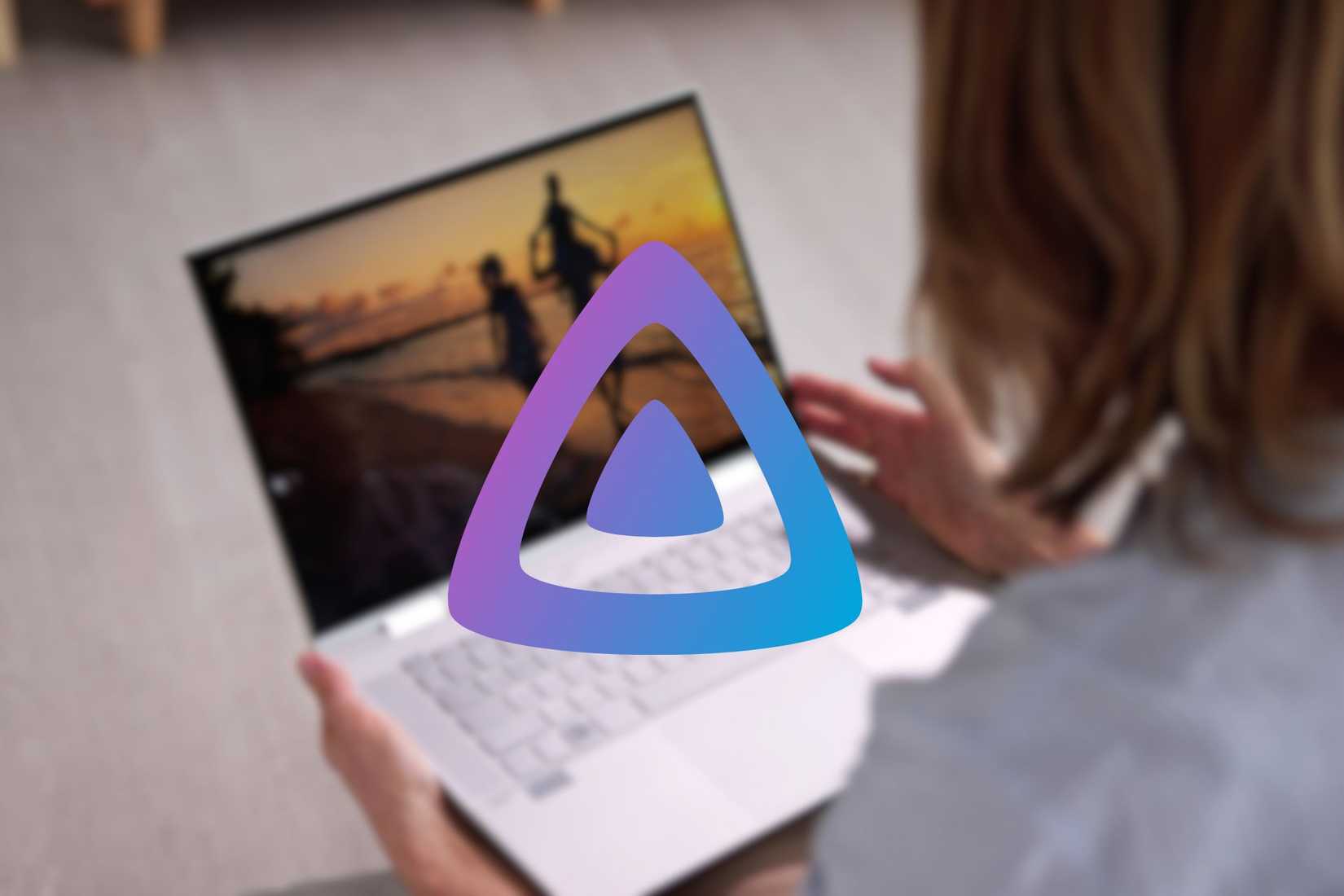 a jellyfin logo on a blurred background of a woman watching a movie on a laptop