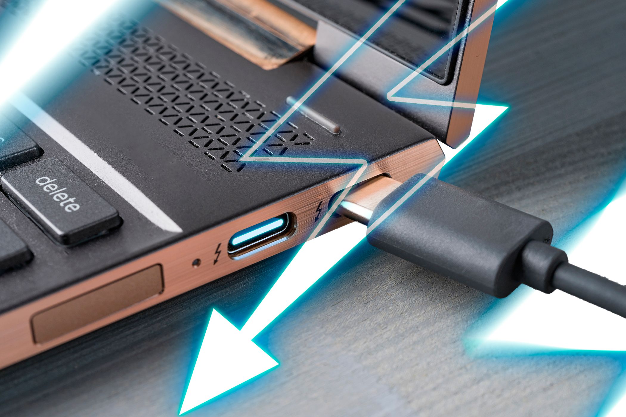 Close-up photo of a laptop with a Thunderbolt USB-C port and a thunderbolt icon