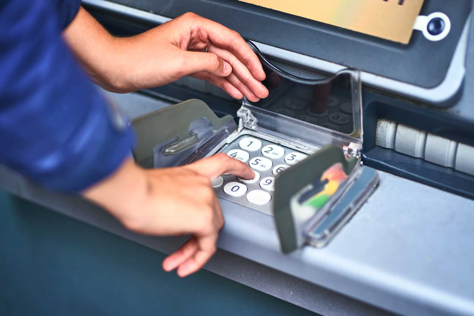 Get Ready to buy atm skimmer person inputting pin on atm device
