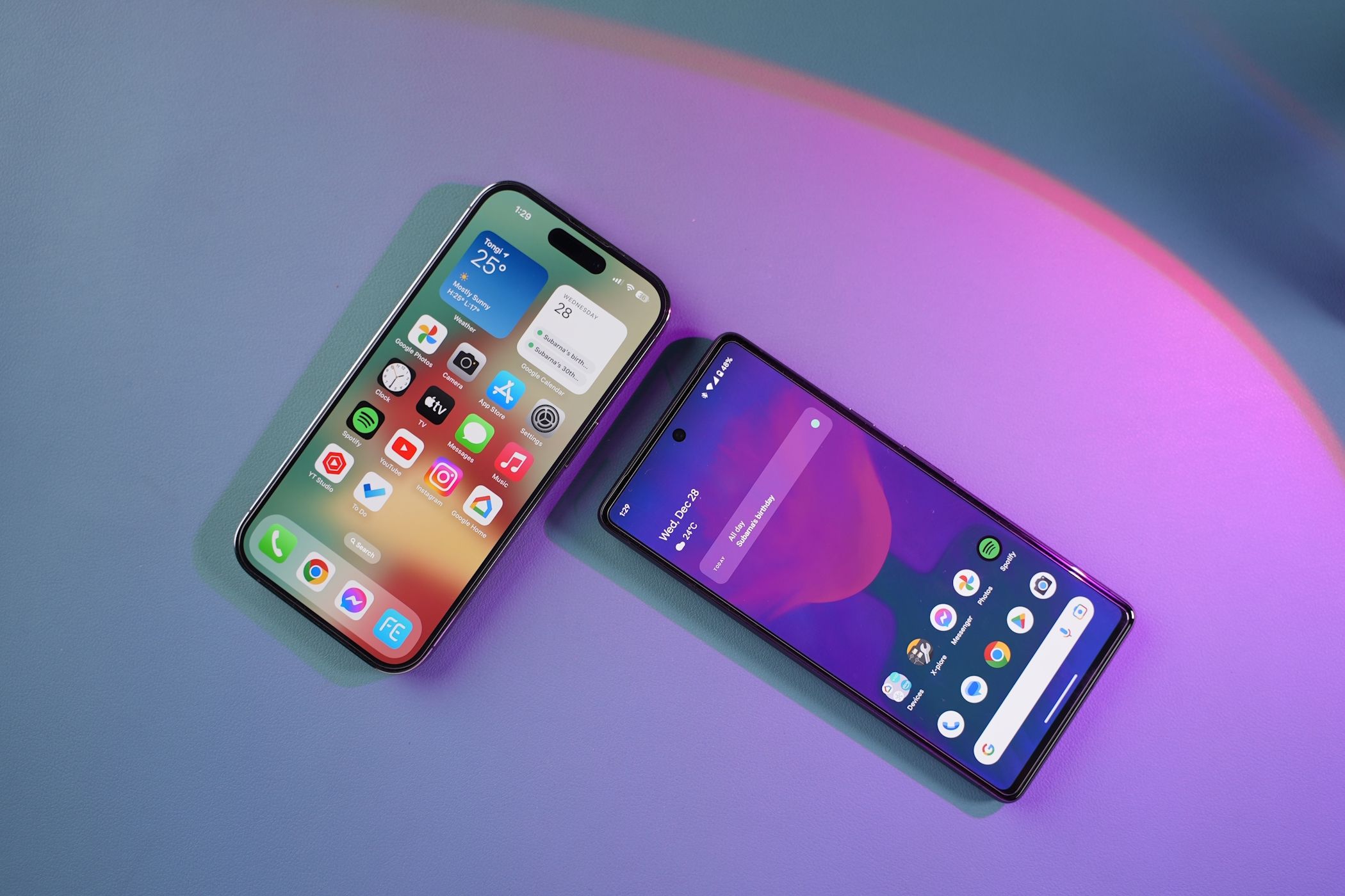 An iPhone next to a Google Pixel phone