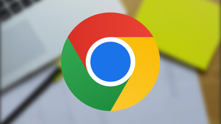 Google Chrome logo in front of a desk with articles and a highlighter