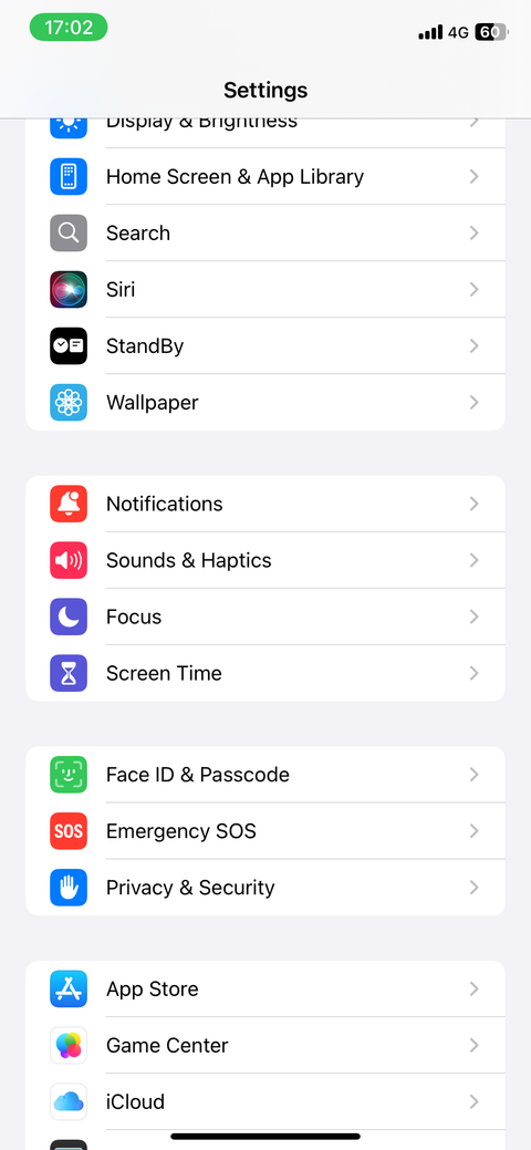 iPhone settings app with the Notifications option at the center