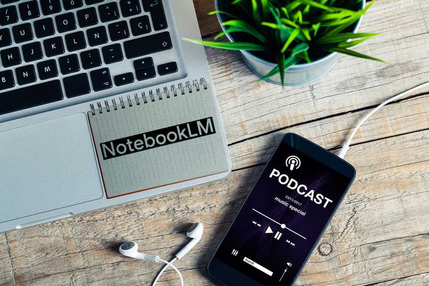 Laptop and phone playing a podcast with the NotebookLM logo on a desk