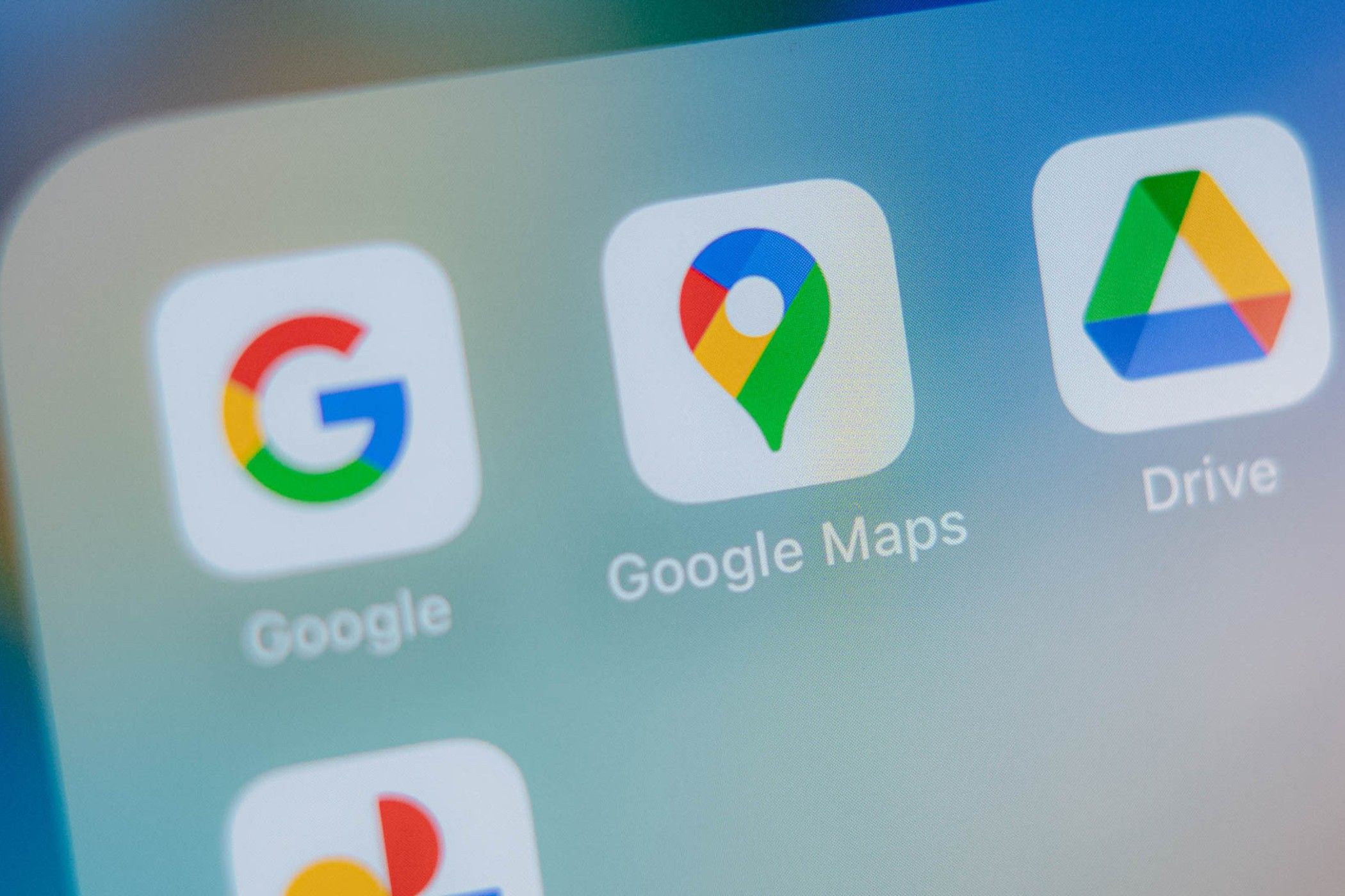 Google Maps icon on phone screen.