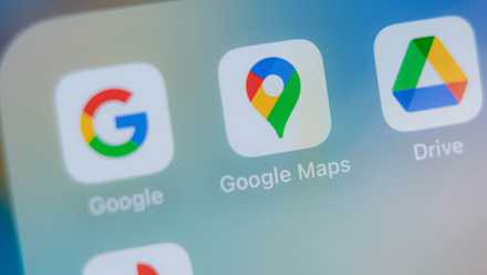 Google Maps icon on phone screen.